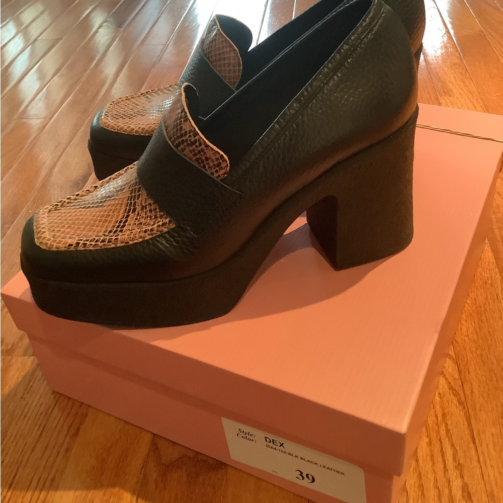 Black leather loafers with platform sole and heel.